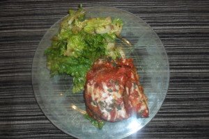 baked eggplant and salad on plate