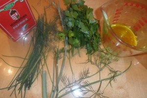 collection of fresh herbs, Hungarian paprika, and olive oil