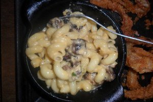 curly macaroni with cheeses and wild boar