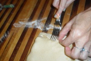 crimping the edge with a fork