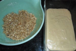 Streusel topping in one bowl, and loaf pan with 2/3 of the bread batter.