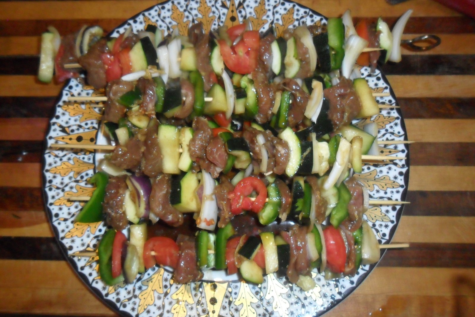 Loaded skewers on a fancy plate