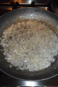 Onion and wine mixture in pan