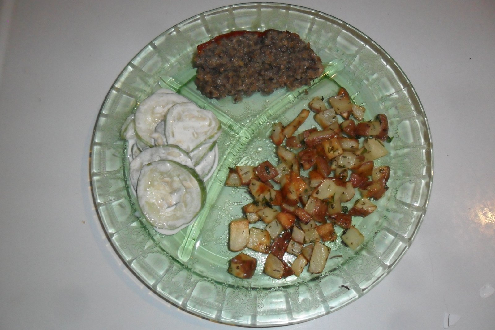 Grill plate with large serving of roasted potatoes.