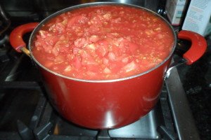 Large pot of chopped tomatoes boiling