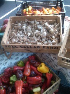 Crates of garlic and sweet peppers