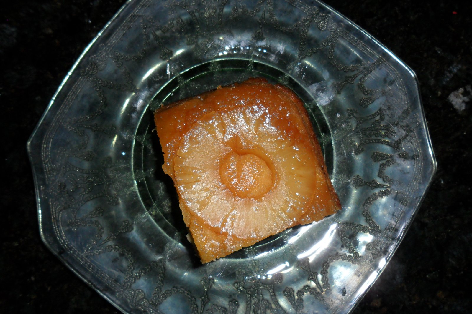 slice of pineapple upside down cake on plate