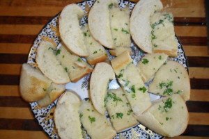 slices of garlic bread on sparkly plate