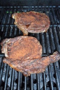 Steaks with rub on the grill