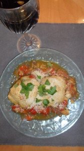 Tomato casserole with a glass of wine