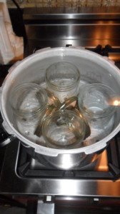 Jars and lids sterilizing in hot water.