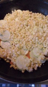 Squash, carrots, and corn cooking