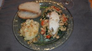 Grill plate with main recipe, corn casserole, and fresh bread