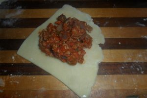 Putting the filling on the dough