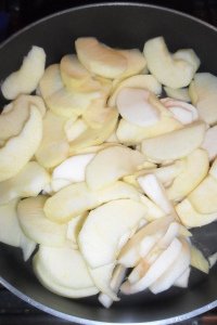 Variety of raw apples in pan