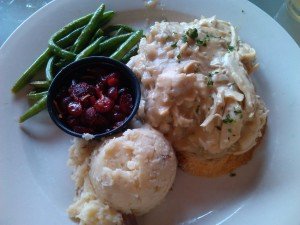 Green beans, mashed red potatoes, cranberry chutney and shredded turkey on sourdough