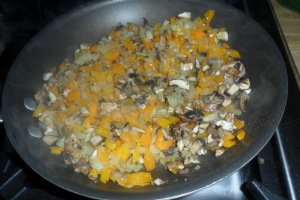 Cooking onions, mushrooms, yellow pepper, garlic, and parsley