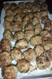 Browned meatballs ready for the oven.