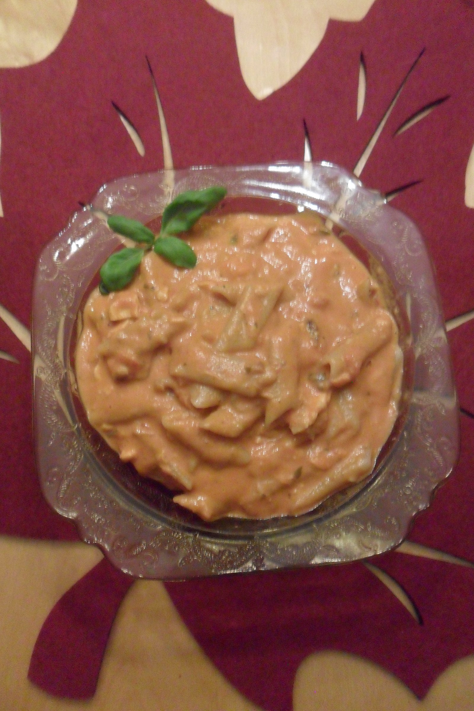 Salmon pasta in a bowl with basil