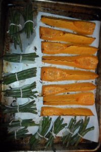 Roasting bean bundles and squash together.