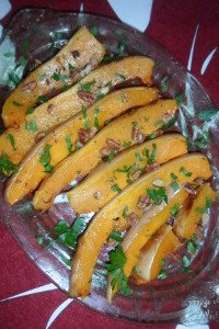 Serving dish with beautiful, orange, garnished, roasted butternut