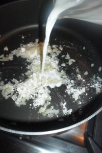 Stirring the cream into the onion mixture