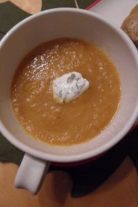 Carrot soup in bowl with garnish