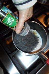 Adding poppy seed to pan for filling.