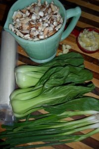 Ingredients for quiche with bok choy in center