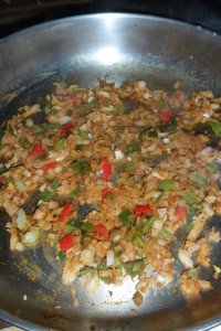 Paprika stirred into cooking vegetables.