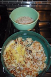 Adding egg to potatoes.