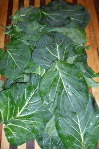 Lots of leafy greens on counter.