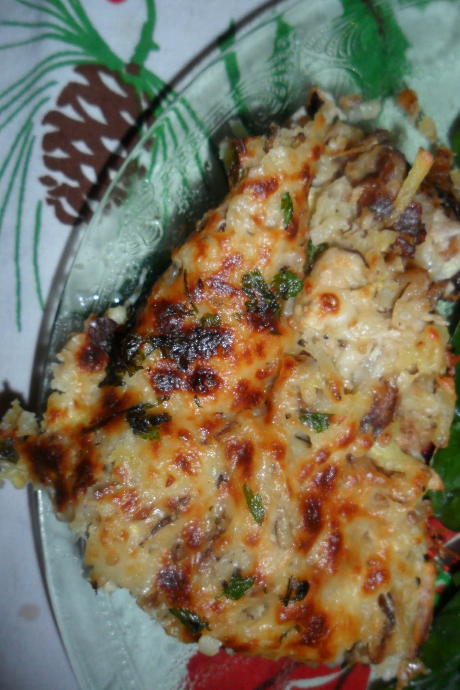 Serving hash brown casserole on pine cone tablecloth.