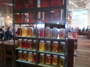 Shelf with full gallon jars.