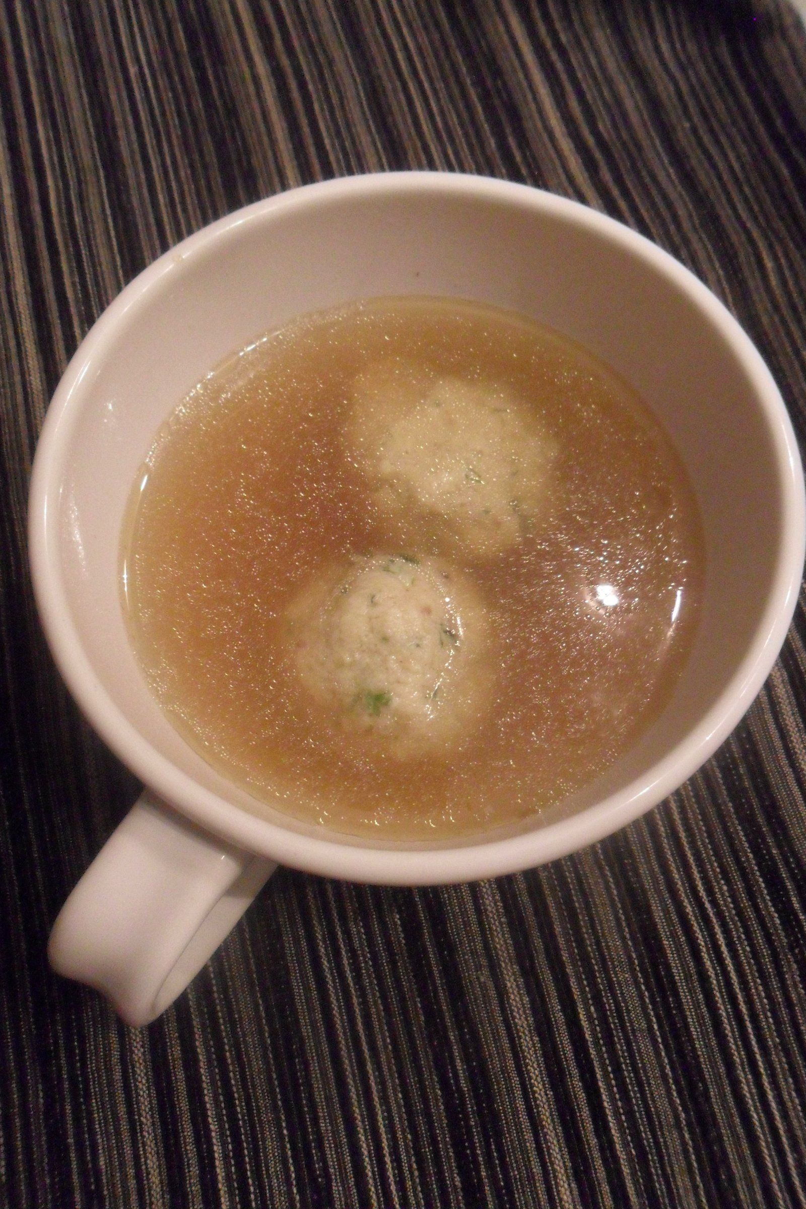 Serving the matzo ball soup.