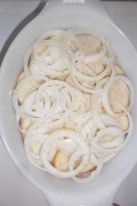 Onion slices on potatoes.