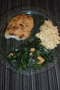 Serving tilapia with kale and macaroni.