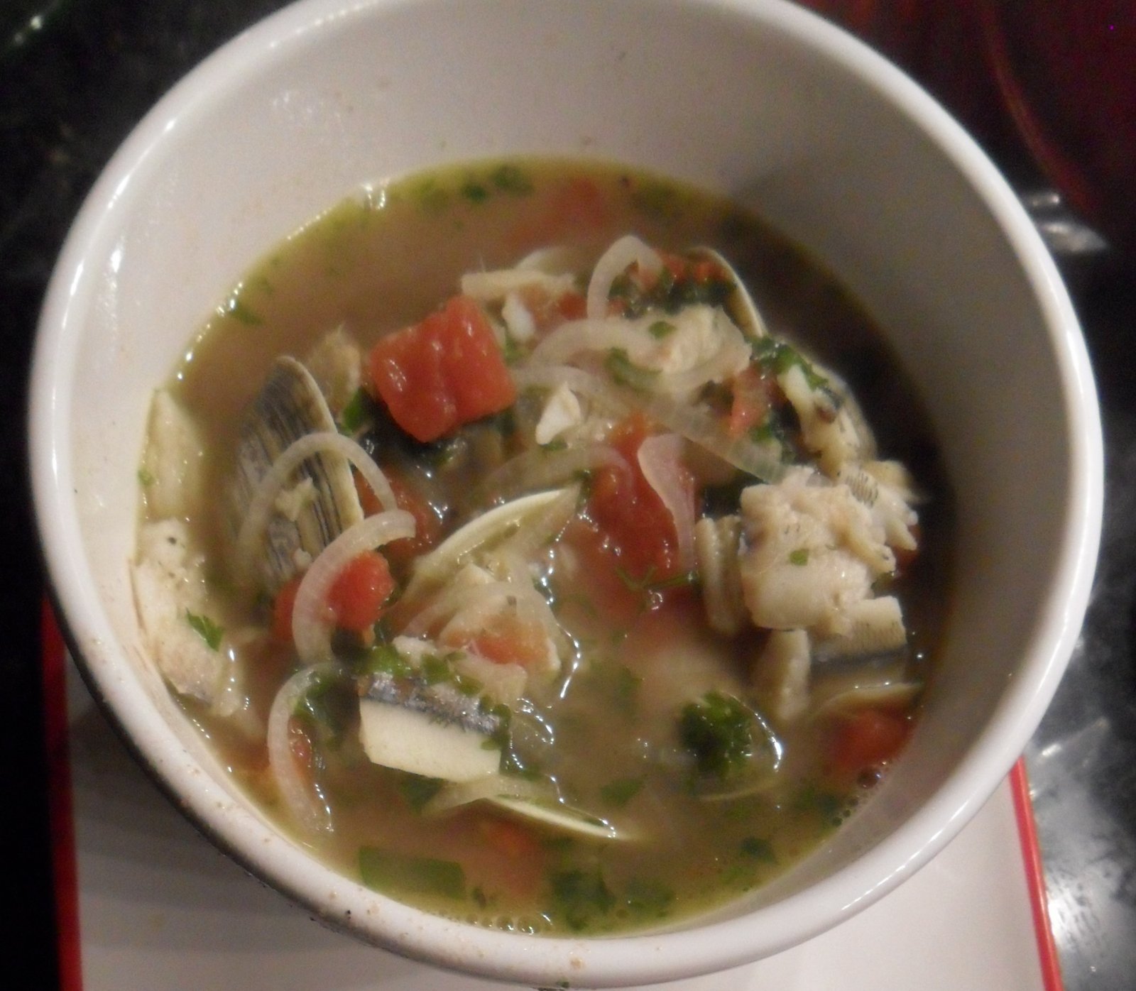 Giant serving bowl of hearty fish soup.