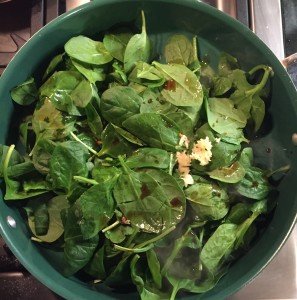 All spinach ingredients in pan.