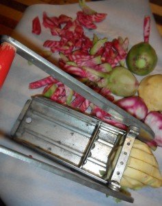 Using an antique fry cutter on the vegetables.