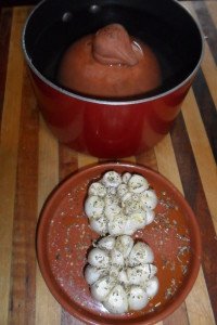 Preparing garlic heads and roaster lid.