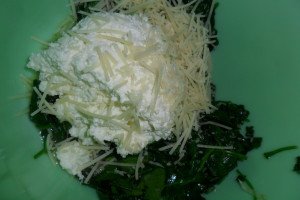 Mixing the spinach ingredients.