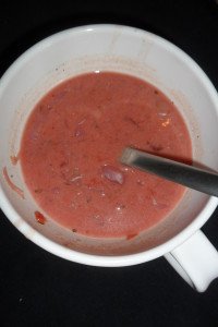 Soup and spoon in serving bowl.