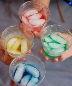 Four glasses of unnaturally colored drinks.