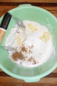 Cuttin the butter into dry ingredients.