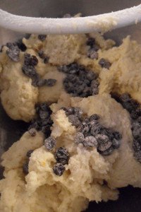 Adding the currants to the bread.