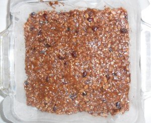 Bar mixture pressed in baking dish.