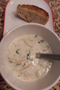 Serving gnocchi soup with grilled bread.