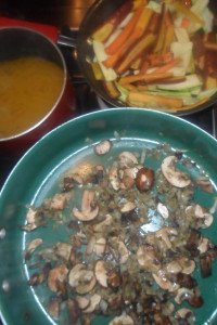 Cooking mushroom mixture, alongside sliced vegies with stock on the side.