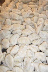 Baking dish full of fresh gnocchi.